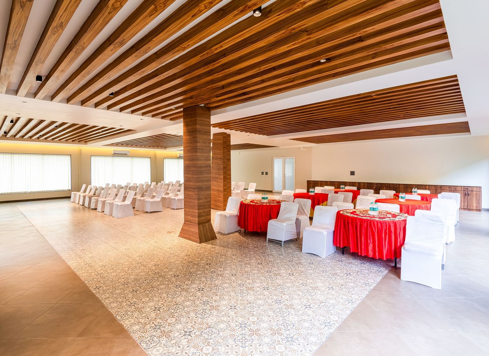 Banquet Hall at DLS Divine River Resort and Spa featuring  chairs table and a stage